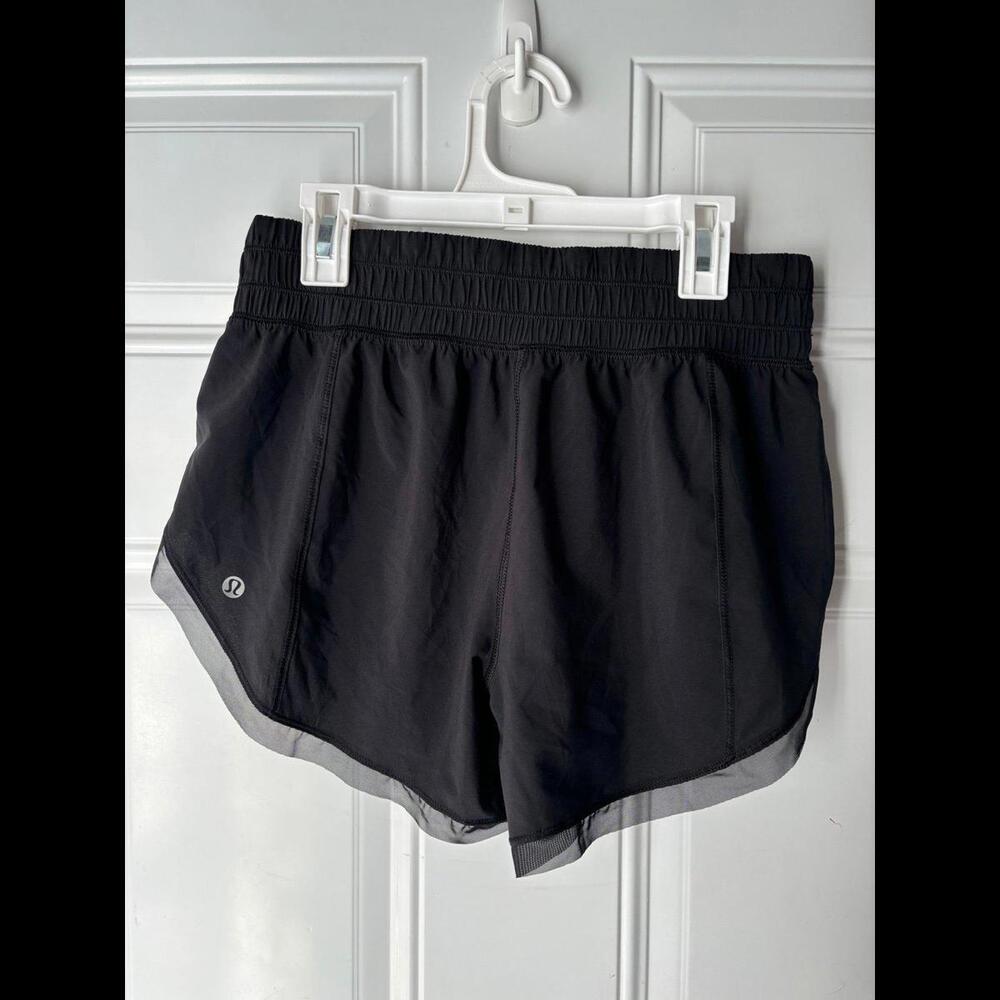 Lululemon black shorts with mesh detail on the bottom. No built in liner. Size 4